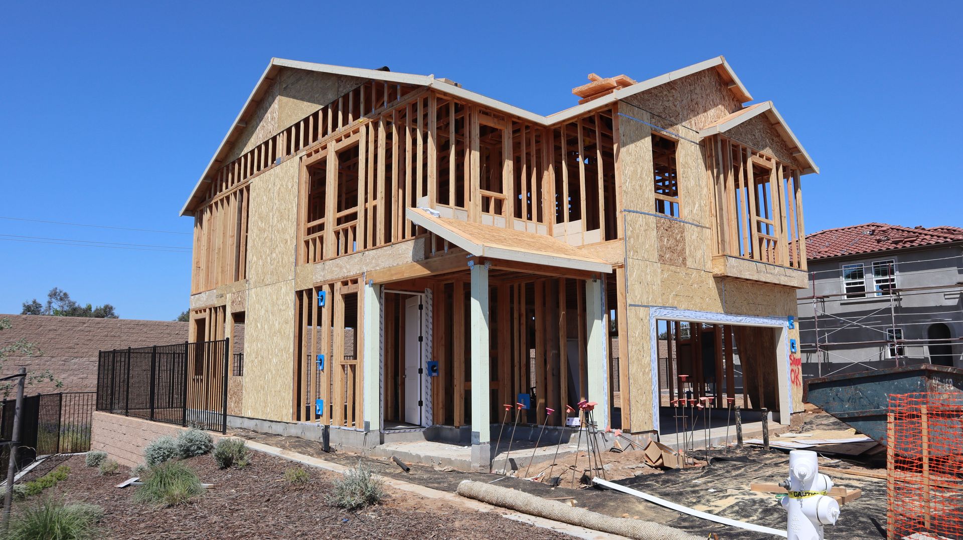 New suburban house in Elk Grove, California under construction, showing framing and development.