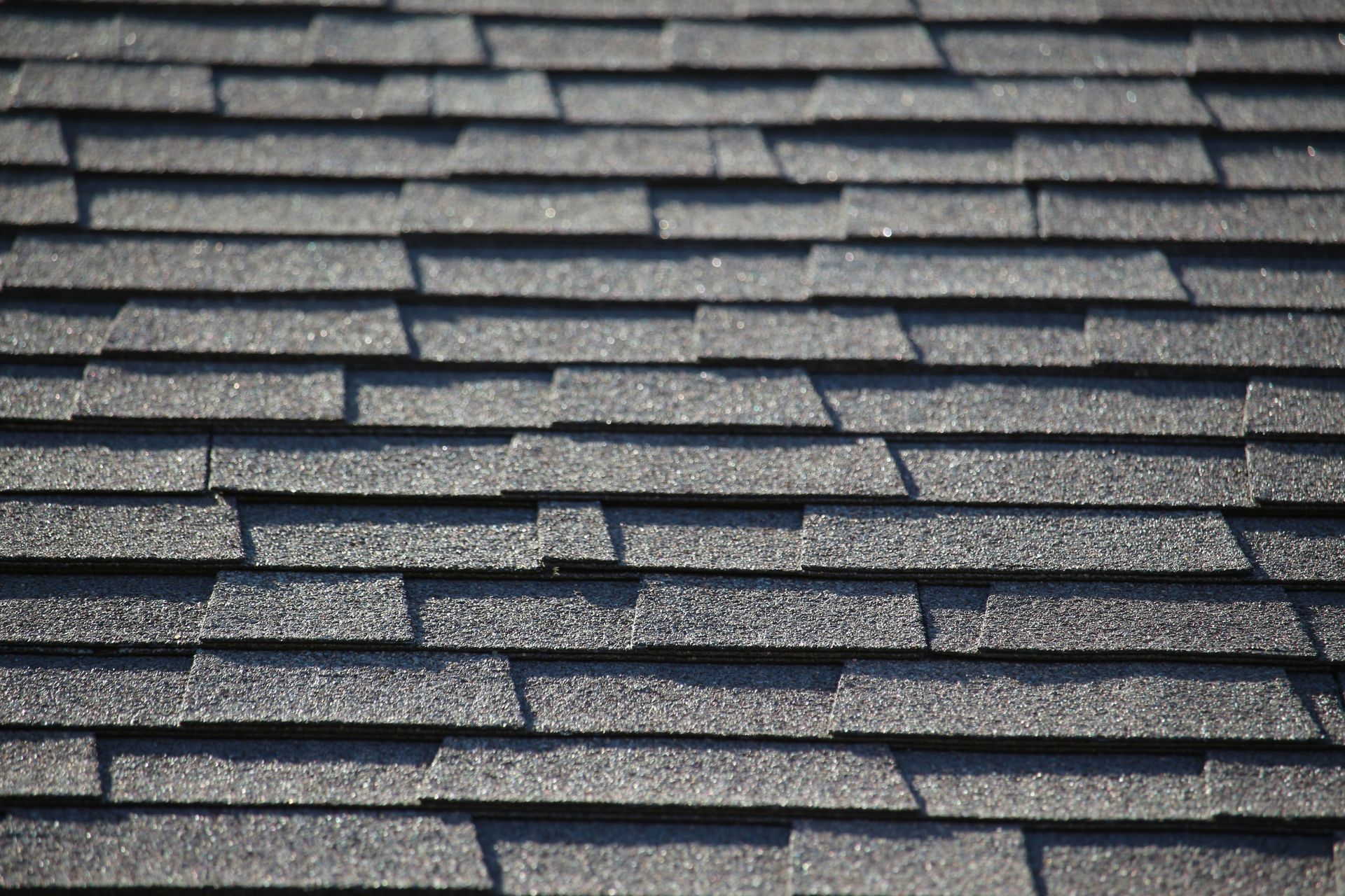 a close up of a roof with a bird perched on top of it